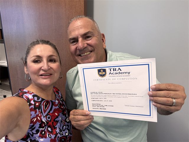 A TRA Academy student holding their 90-hour course certificate of completion with instructor Nora Acosta